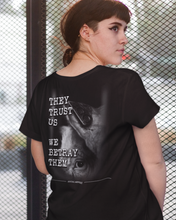 'They Trust Us, We Betray Them' [Back Design] Unisex Vegan T-shirt