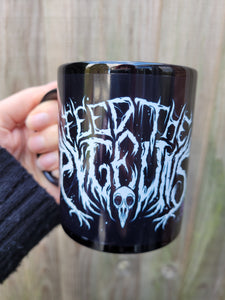 'Feed The Pigeons' Black Glossy Mug